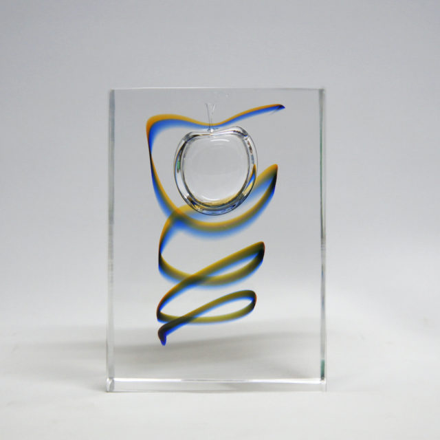 Enclosed Apple in the glass